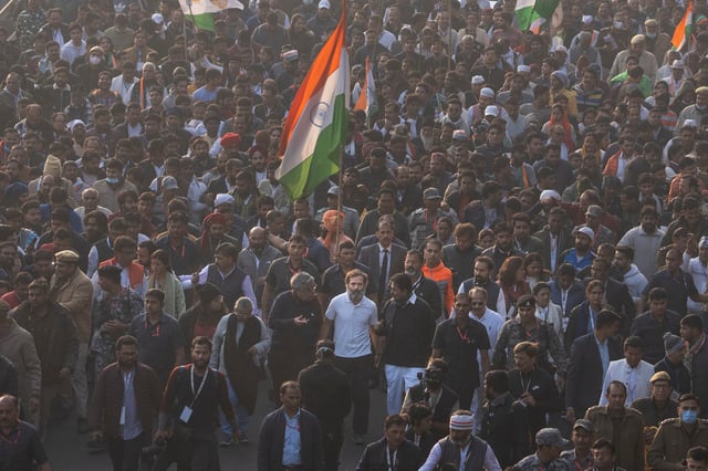 Rahul Gandhi (centre in white T-shirt) walks with his supporters during a march in New Delhi, India, in December 2022. Photo: AP
