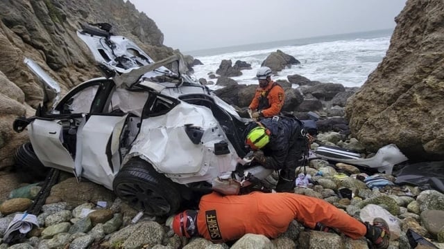 FILE - In this photo provided by the San Mateo County Sheriff's Office, emergency personnel respond to a vehicle over the side of Highway 1 on Jan. 1, 2023, in San Mateo County, Calif. A California radiologist accused of trying to kill his family when he drove his Tesla off a cliff along the Northern California coast will receive mental health treatment instead of standing trial, a judge ruled. (Sgt. Brian Moore/San Mateo County Sheriff's Office via AP, File)