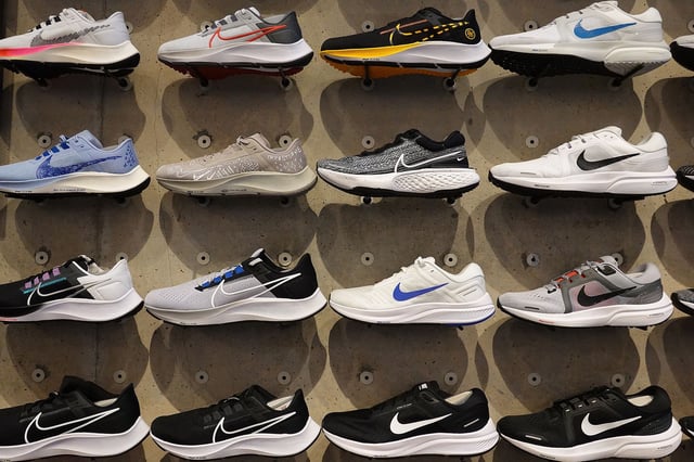Shoes line the shelves at the Nike store on December 21, 2021 in Miami Beach, Florida.