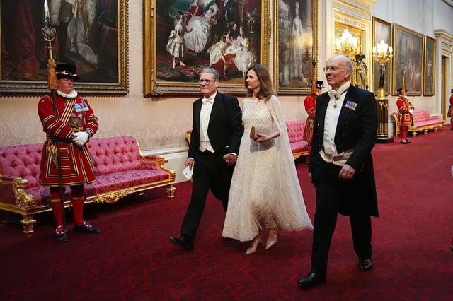 The couple make their way to the State Banquet for Emperor Naruhito and his wife Empress Masako of Japan at Buckingham Palace, London, in June.