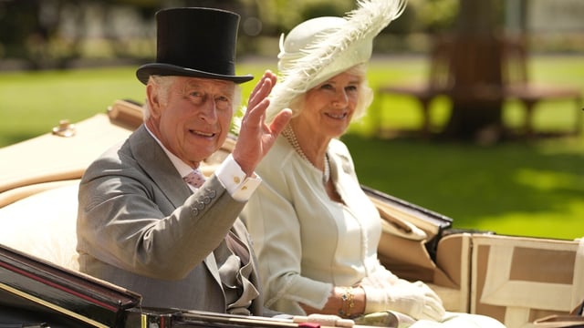 FILE - Britain's King Charles III and Camilla, the Queen Consort arrive in a carriage for Ladies Day of the Royal Ascot horse racing meeting, at Ascot Racecourse in Ascot, England, Thursday, June 22, 2023. King Charles III and Queen Camilla will visit France in September, Buckingham Palace said Thursday, Aug. 24, 2023, after their planned state visit in March was postponed amid widespread demonstrations against President Emmanuel Macron's retirement age reforms. (AP Photo/Alastair Grant, File)