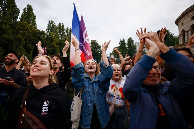 Supporters of French far-left opposition party La France Insoumise (France Unbowed - LFI) react after partial results in the second round of the early French parliamentary elections at Place Stalingrad in Paris, France, July 7, 2024. REUTERS/Yara Nardi