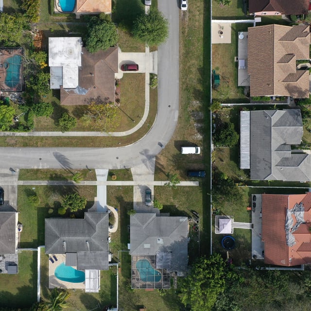 In an aerial view, homes sit on lots in a neighborhood on January 26, 2023 in Pembroke Pines, Florida.