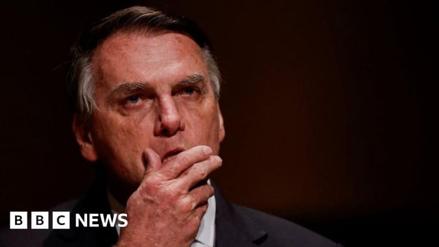 Jair Bolsonaro reacts at an event at the Municipal Theatre in Sao Paulo, Brazil, in March