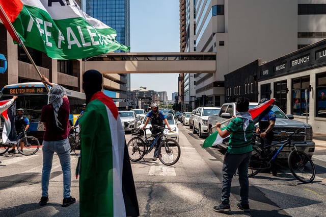 Law enforcement blocks an intersection as pro-Palestinian demonstrators protest the ongoing war with Israel in Gaza on the annual remembrance of Nakba near the Texas state Capitol on May 19 in Austin, Texas.