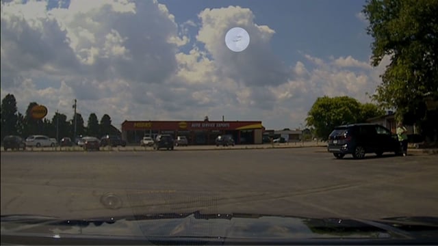 An image taken from video shows two planes appearing to cross paths over Syracuse Hancock International Airport.  A portion of this image was highlighted by CNN for emphasis.