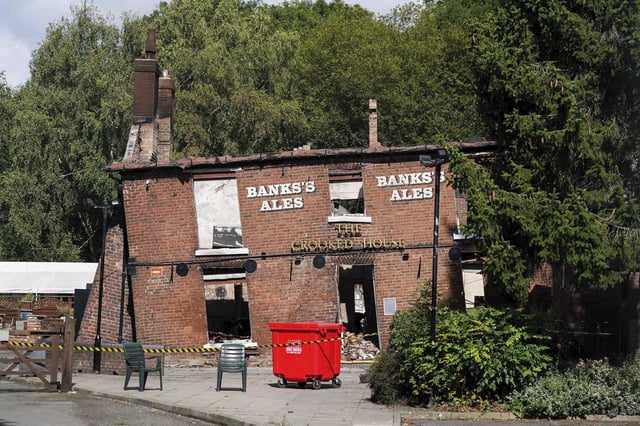 FILE - The burnt remains of The Crooked House pub in Himley. England, Aug. 7, 2023. British police said Thursday Aug. 24, 2023, two men have been arrested on suspicion of burning down an historic English pub that was famous for its lopsided walls and sagging foundation. (Jacob King/PA via AP)