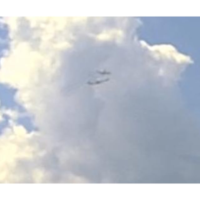 A screenshot from the dashcam footage of the North Syracuse Police Department. The two planes can be seen nearly colliding, after air traffic control cleared one for takeoff as another was landing.