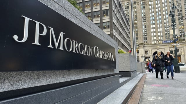 FILE - Pedestrians approach JPMorgan Chase headquarters on Dec. 29, 2023, in New York. JP Morgan reports earnings on Friday, July 12, 2024. (AP Photo/Peter Morgan, File)