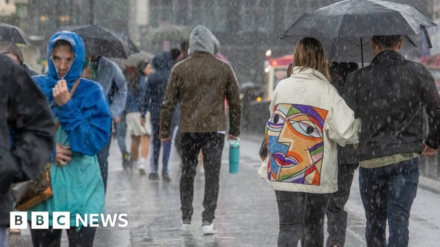People walking in the rain