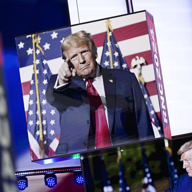 Images of Donald Trump appear on stage screens in the Fiserv Forum on the day before the Republican National Convention (RNC) on July 14, 2024, in Milwaukee, Wisconsin. The RNC will be held in Milwaukee from July 15-18.