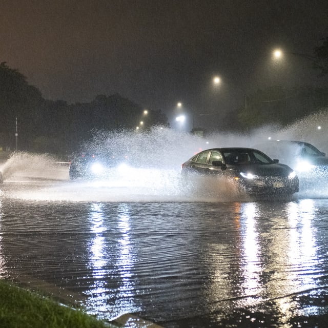 Vehicles make their way through a flooded section of DuSable Lake Shore Drive after a second severe storm raged through Chicago, Monday, July 15, 2024.