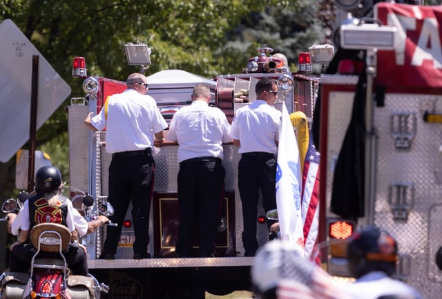 Pallbearers ride with the casket of Corey Comperatore from Cabot United Methodist Church in Winfield Township to the cemetery Friday, July 19th. Comparatore was killed at SaturdayÕs rally for former President Donald Trump from a would-be assigns stray bullet. Kevin Whitlock / Massillon IndependentnPublished Image