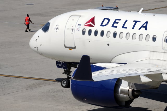 A Delta Air Lines jet leaves the gate, Friday, July 19, 2024, at Logan International Airport in Boston. Some airline issues are continuing on Monday after a faulty software update caused technological havoc worldwide and resulted in several carriers grounding flights, but the number of flights impacted is declining. (AP Photo/Michael Dwyer, File)