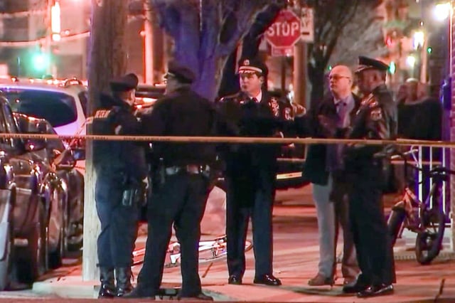 Police investigate a crime scene in South Philadelphia on March 1, 2022.