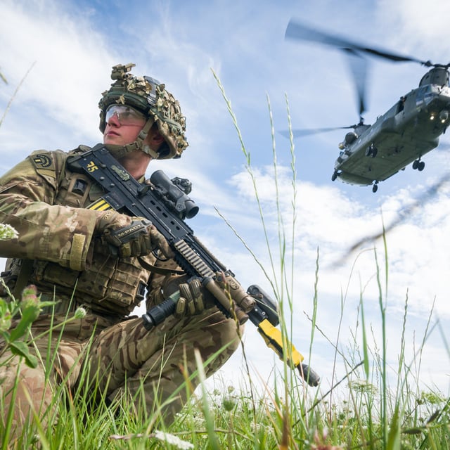 Private Patrick Rodgers of the Anglian Regiment, 2nd Battalion maintains the perimeter as a Chinook helicopter carries out a medical evacuation during a military exercise on Salisbury Plains on July 23, 2020 near Warminster, England. "I have a bold ambition to double our fighting power in three years and triple it by the end of the decade," General Sir Roly Walker, the new chief of the U.K.'s General Staff, said during a land warfare conference in London on Tuesday.