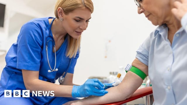 Woman giving blood