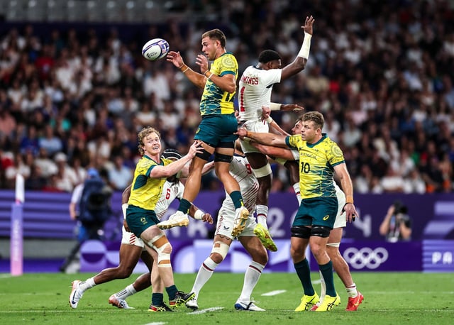Nathan Lawson #12 of Team Australia wins the line out against Aaron Cummings #1 of Team United States during the Men's Rugby Sevens Quarter-Final match between Australia and United States at Stade de France on July 25, 2024 in Paris.
