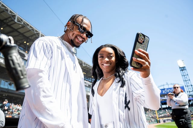 Simone Biles and Jonathan Owens take a selfie prior to a game between the White Sox and Reds at Guaranteed Rate Field in Chicago.
