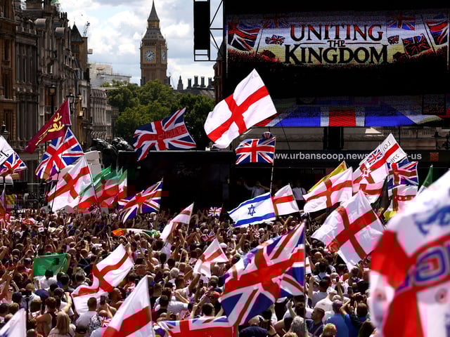 Supporters of British far-right activist and founder and former leader of the anti-Islam English Defence League (EDL), Stephen Yaxley-Lennon, also known as Tommy Robinson attend a rally at Trafalgar square in central London on July 27, 2024. (Photo by HENRY NICHOLLS / AFP) (Photo by HENRY NICHOLLS/AFP via Getty Images)