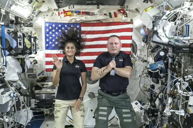 Astronauts Suni Williams, left, and Butch Wilmore give a news conference aboard the International Space Station on July 10, 2024.