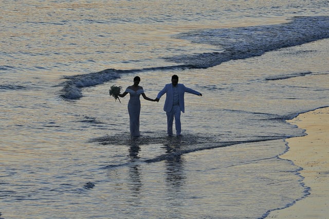 Newlyweds on a beach in Xiamen, southeast China on Dec. 28, 2023. 