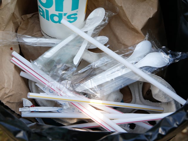 28 June 2019, Berlin: A plastic cup for a shake, a beverage cup for soft drinks and disposable plastic crockery lie in a garbage can. The fast food chain McDonald's wants to produce less plastic waste. For example, desserts are to be sold in the course of the coming year in more sustainable packaging "almost without plastic". Already this year plastic holders for balloons would be abolished, McDonald's announced. From 2021 they will no longer be allowed to be sold in the EU - as will disposable cutlery and plates and plastic straws. Photo: Gerald Matzka/dpa-Zentralbild/ZB (Photo by Gerald Matzka/picture alliance via Getty Images)