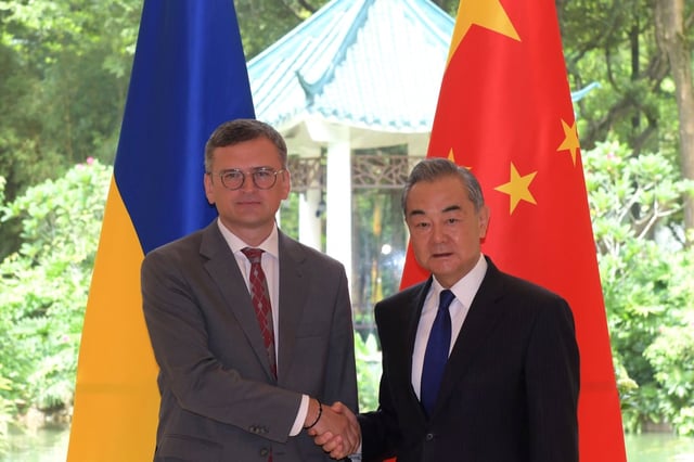 Ukrainian Foreign Minister Dmytro Kuleba meets his Chinese counterpart Wang Yi in Guangzhou on July 24. Photo: AP