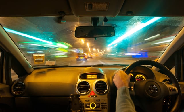 Man driving car at night