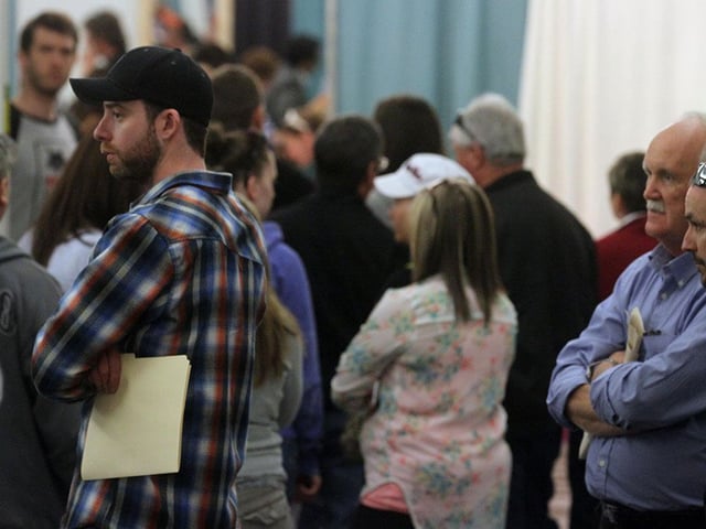 Job seekers line up at job fair in New Brunswick. 