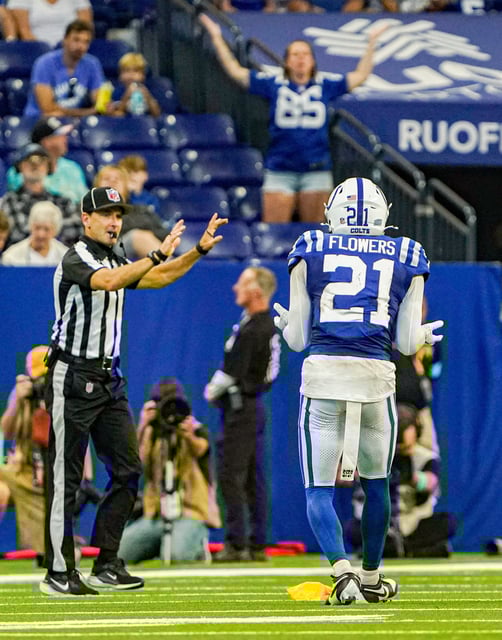 Indianapolis Colts cornerback Dallis Flowers (21) is flagged on a play during a pre-season game between the Indianapolis Colts and the Denver Broncos on Sunday, August. 11, 2024 at Lucas Oil Stadium in Indianapolis.