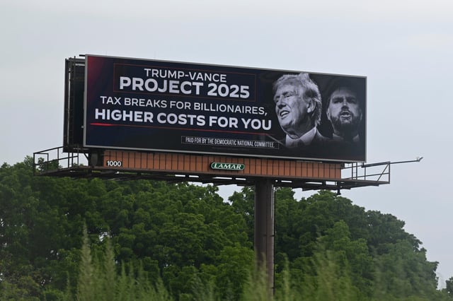 Jul 16, 2024; Milwaukee, WI, USA; A billboard protesting the controversial ‘Project 2025’ agenda and the Trump-Vance Republican presidential ticket is seen in Milwaukee before the start of the second day of the 2024 Republican National Convention at the Fiserv Forum. The second day of the RNC focused on crime and border policies. Mandatory Credit: David Baratz-USA TODAY