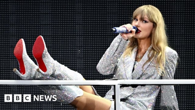 Taylor Swift in a sparkly dress and matching boots