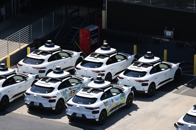 Self-driving Waymo cars sit in the Waymo depot lot in Bayview, in San Francisco on Wednesday, July 19, 2023. In July of 2023, the San Francisco Municipal Transportation Agency urged the state to collect more data before allowing companies to expand the fleet of autonomous vehicles in the city.