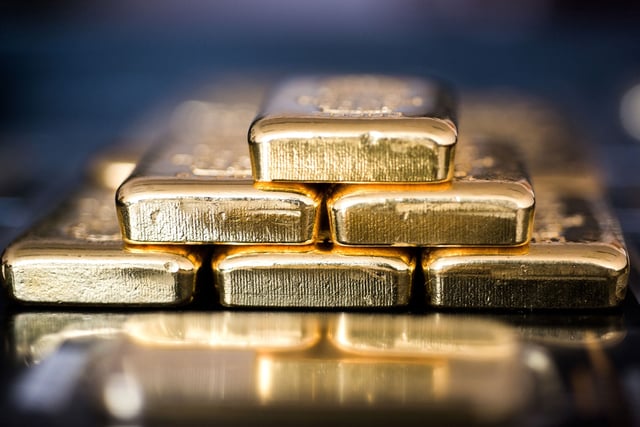 Gold bars sit stacked in this arranged photograph in Hungary. Photographer: Akos Stiller/Bloomberg