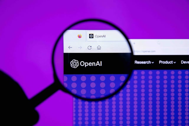 OpenAI homepage on Firefox browser, with a magnifier glass against the logo