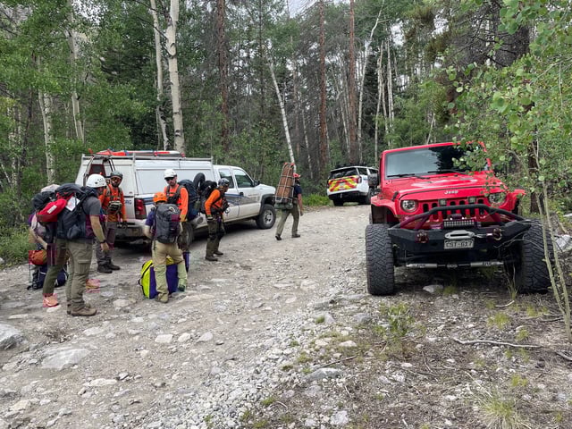 Chaffee County search and rescue personnel look for a hiker stranded near Mount Shavano, Colorado.