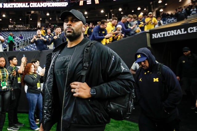 Michigan offensive coordinator Sherrone Moore arrives for the national championship game at NRG Stadium in Houston on Monday, Jan. 8, 2024.