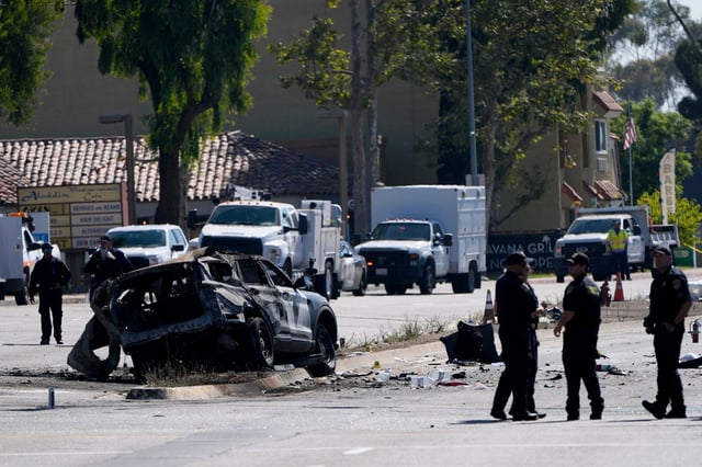A charred police vehicle  on Aug. 27, 2024, in aftermath of an overnight crash in San Diego.