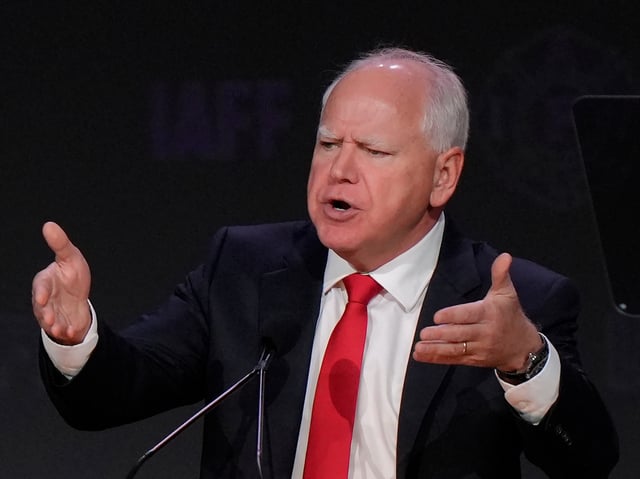 Democratic vice presidential nominee Minnesota Gov. Tim Walz addresses an audience at the International Association of Fire Fighters convention, Wednesday, Aug. 28, 2024, in Boston. (AP Photo/Steven Senne)