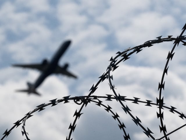 06 June 2024, Brandenburg, Schönefeld: An airplane takes off from BER Airport behind a fence with barbed wire. Photo: Sebastian Gollnow/dpa (Photo by Sebastian Gollnow/picture alliance via Getty Images)