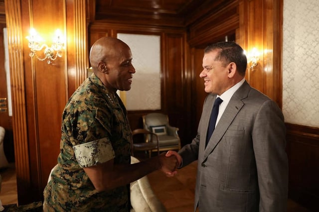 Head of Libya’s Government of National Unity Abdul Hamid al-Dbeibah shakes hands with US Africa Command General Michael Langley, in Tripoli, Libya, August 29, 2024. Photo: Reuters
