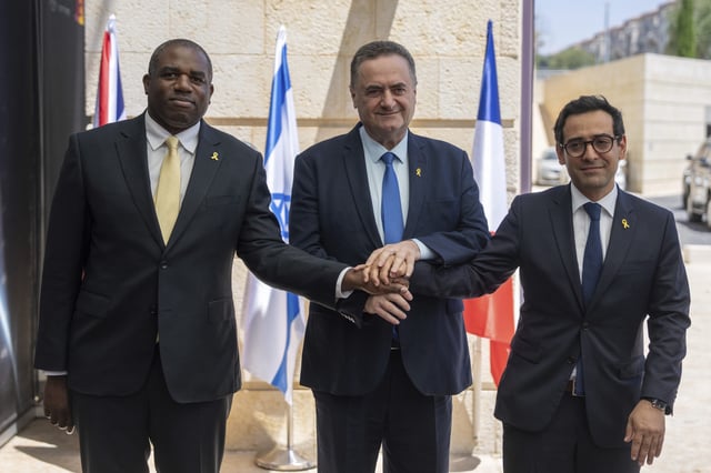 Britain's Foreign Secretary David Lammy, left, and French Foreign Minister Stéphane Séjourné, right, are welcomed by Israeli Minister of Foreign Affairs Israel Katz, at their meeting in Jerusalem in Aug. 16. (Ohad Zwigenberg / AP)