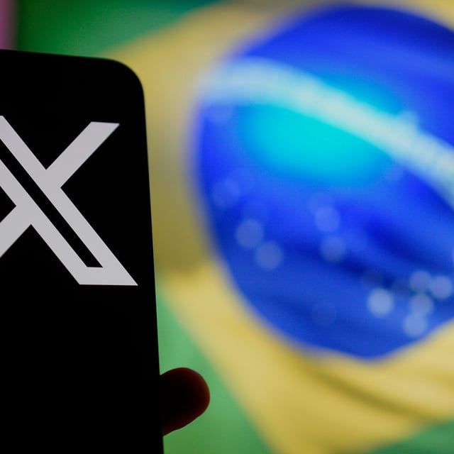 A smartphone shows the X logo. In the background the Brazilian flag is visible.