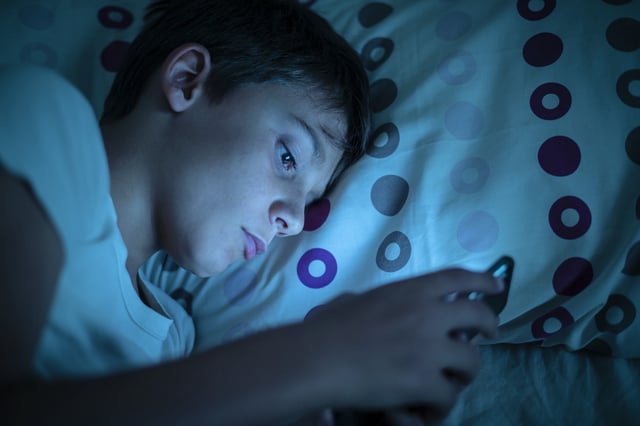 Boy addicted to smartphone insomnia problems