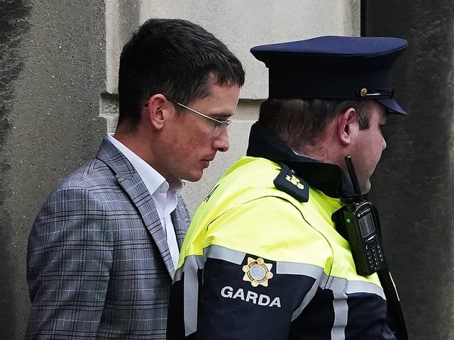 Irish schoolteacher Enoch Burke (left) leaving the High Court, Dublin, to return to Mountjoy Prison, after he refused an opportunity to purge his contempt of court. Mr Burke, who is an evangelical Christian, was suspended from work on full pay last month pending the outcome of a disciplinary process after a number of incidents which stemmed from a transgender row. Picture date: Wednesday September 14, 2022. (Photo by Brian Lawless/PA Images via Getty Images)
