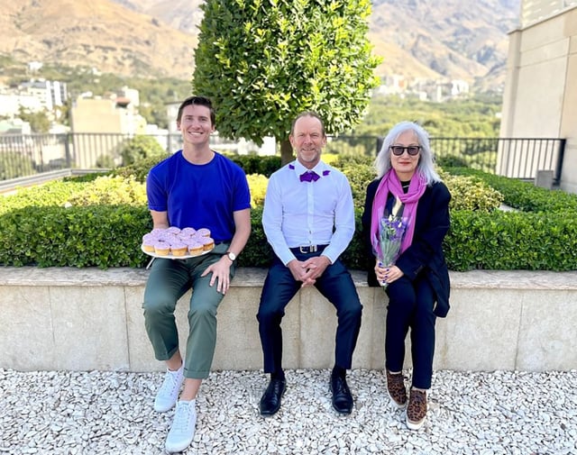 This picture posted on Instagram shows Australian embassy staff wearing purple and holding a plate of purple cupcakes.