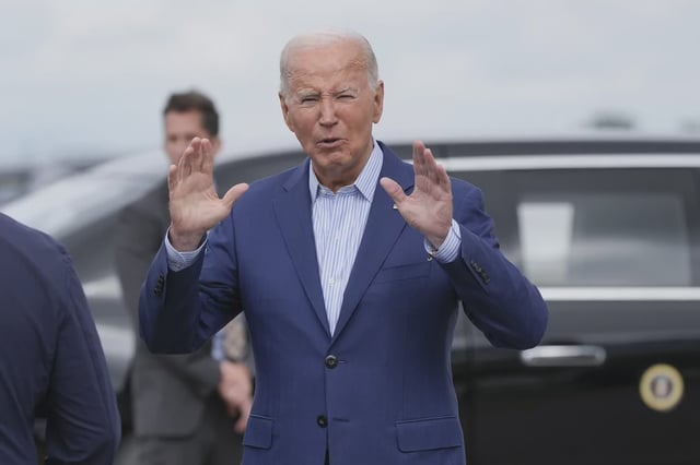 President Joe Biden speaks from a distance after stepping off Air Force One at Detroit Metropolitan Wayne County Airport in Romulus, Mich., Friday, Sep. 6, 2024. (AP Photo/Manuel Balce Ceneta)