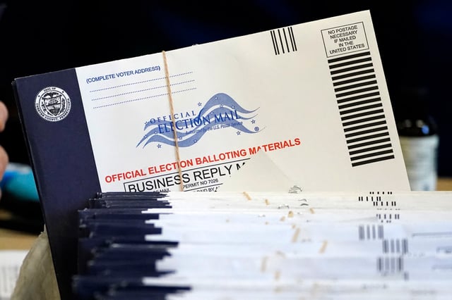 Chester County, Pa., election workers process mail-in and absentee ballots at West Chester University in West Chester, Pa., in 2020. 