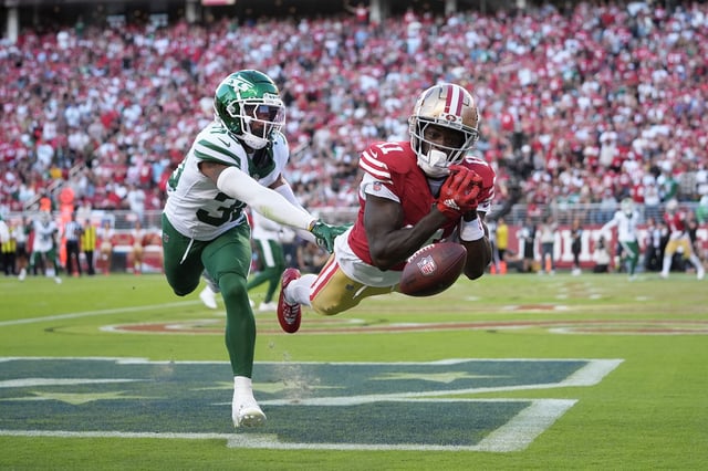 San Francisco 49ers wide receiver Brandon Aiyuk, right, cannot catch a pass in the end zone against New York Jets cornerback Michael Carter II during the first half of an NFL football game in Santa Clara, Calif., Monday, Sept. 9, 2024.
